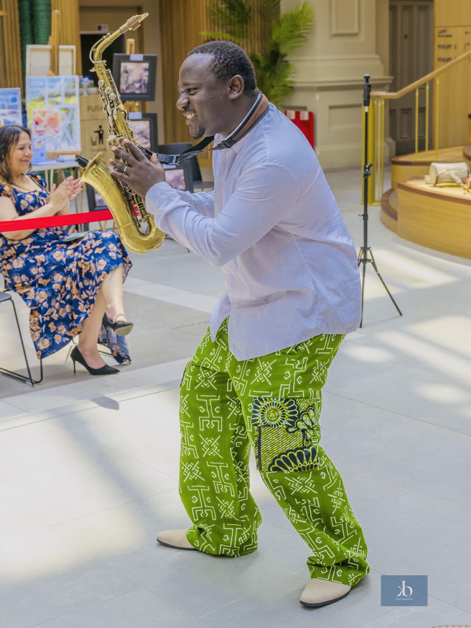 A community drumming circle led by Olamide Sax — the rhythm of home.